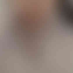 A contemplative portrait of a woman in white and soft pink tones, embodying inner light, emotional delicacy, and a serene elegance that invites introspection.