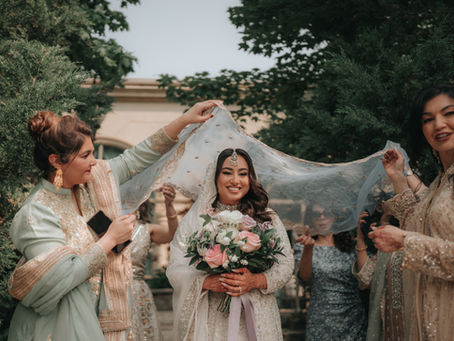 Bride walk into Nika with loved ones