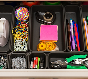 Desk supplies are organized in small boxes