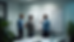 Eye-level view of a small engineering team collaborating around a whiteboard filled with technical diagrams