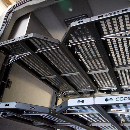 Close-up of four Code 7 bed platforms in Ford Transit camper van, showing option to add extra platforms for more sleeping space.