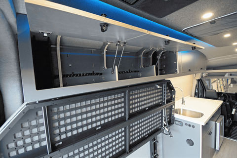Camper van interior storage, efficient van design, upper cabinets in Transit camper van.