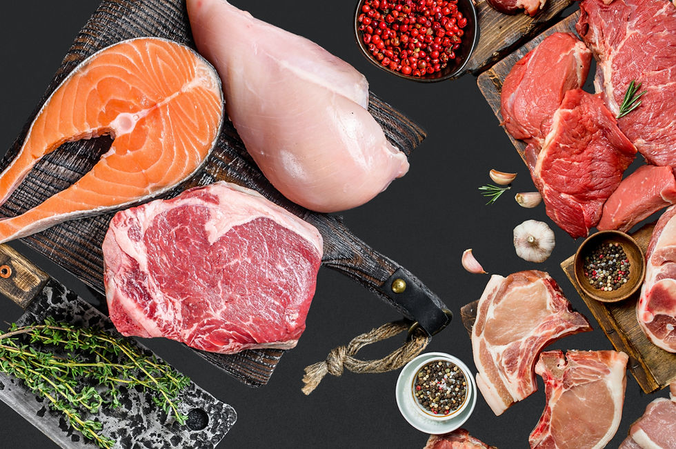PDC Wholesale - Assorted raw meat and seafood cuts, including salmon, chicken breast, ribeye, and pork chops, arranged on dark cutting boards with herbs and spices.