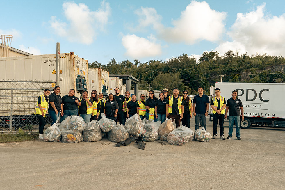 Group photo of the PDC Wholesale team standing in front of refrigerated containers and a branded delivery truck, showcasing company culture, teamwork, and logistics operations.