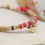 Thumbnail: Pink mix bead bracelet with a golden crystal inset heart charm