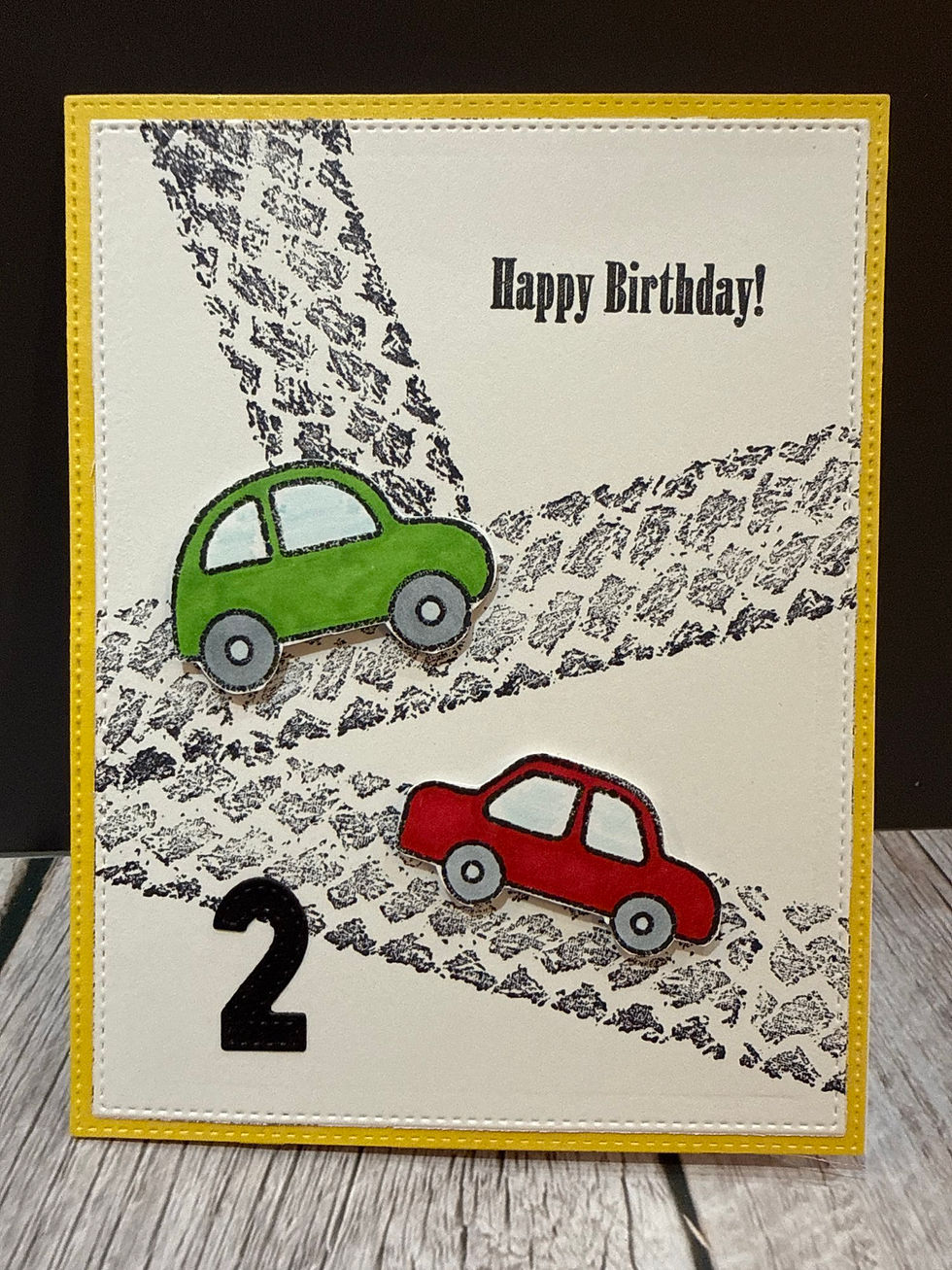 Handmade card; cars and tracks accented with die cut of 2