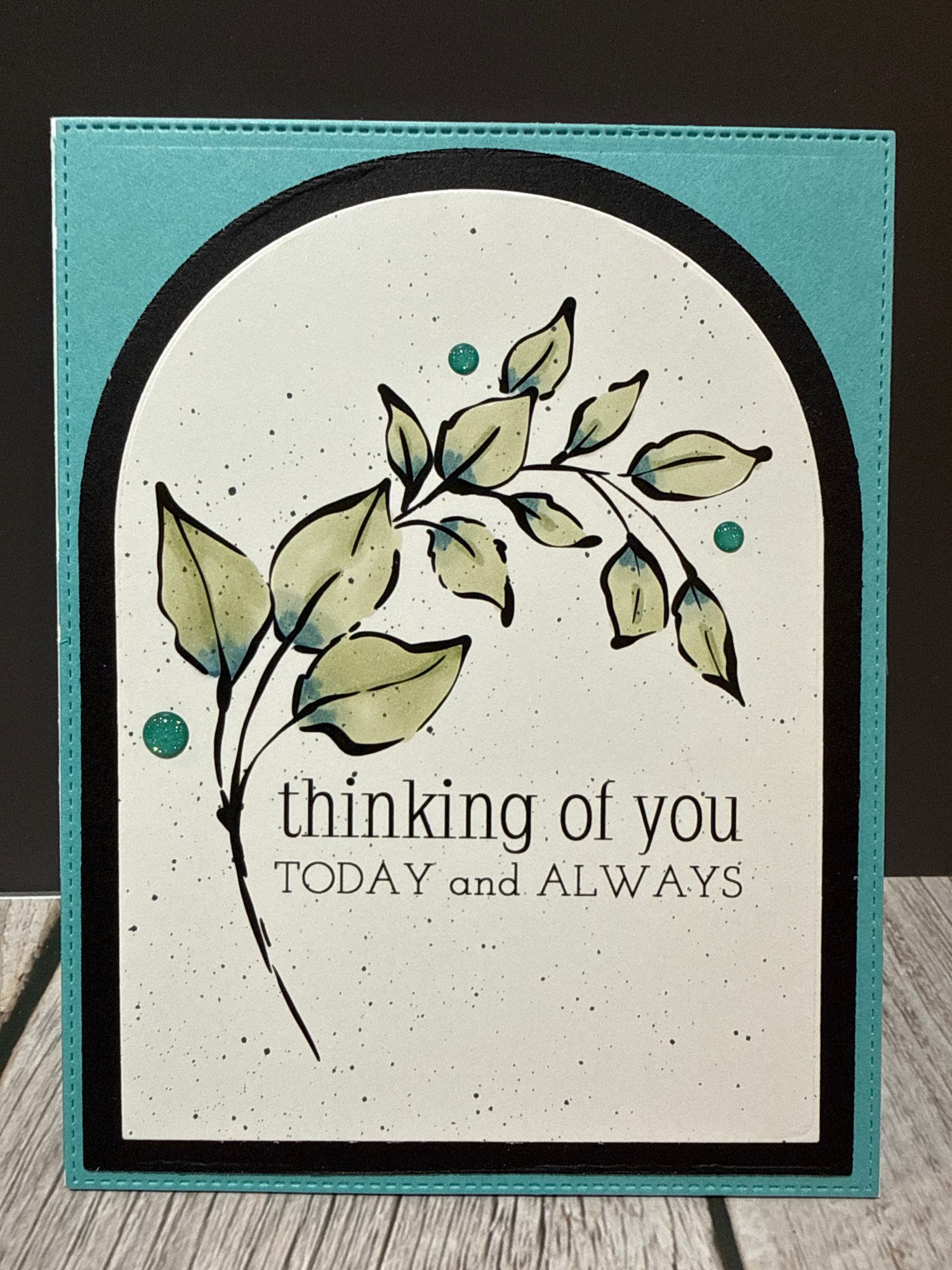 Handmade card; teal background with arched stamped sprig