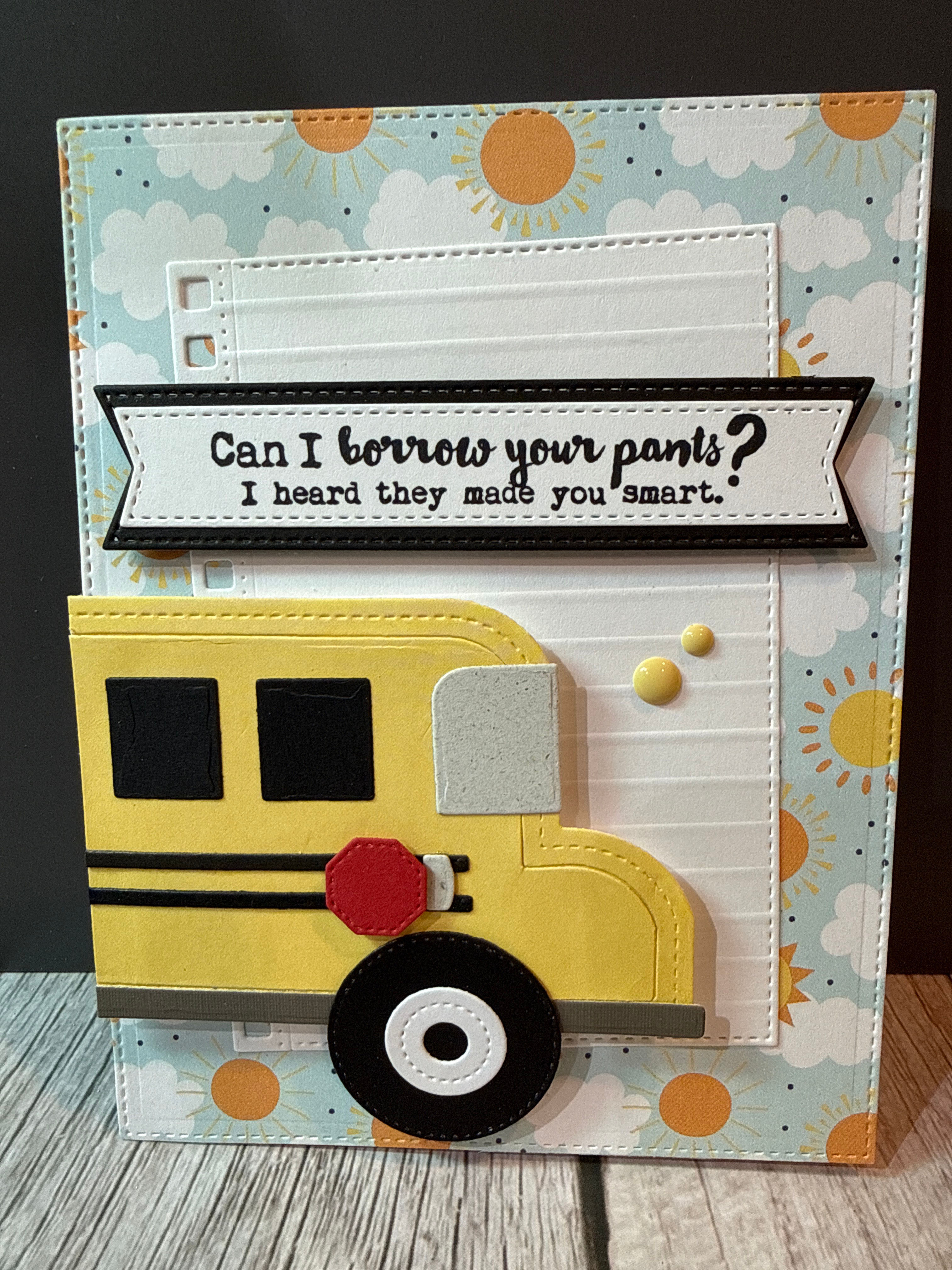 Sun and cloud background with die cut bus