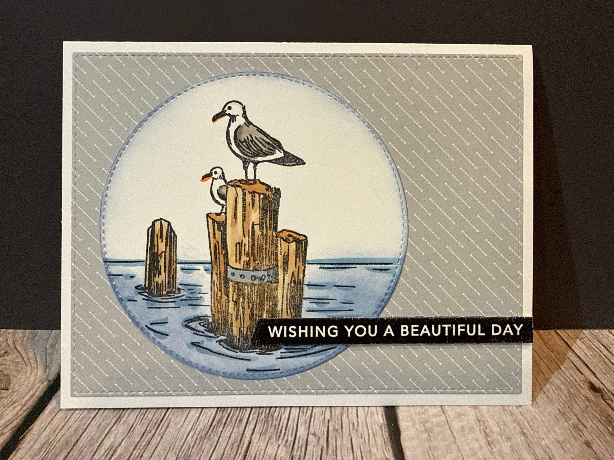 Handmade card shows two seagulls on weathered pilings, WISHING YOU A BEAUTIFUL DAY.