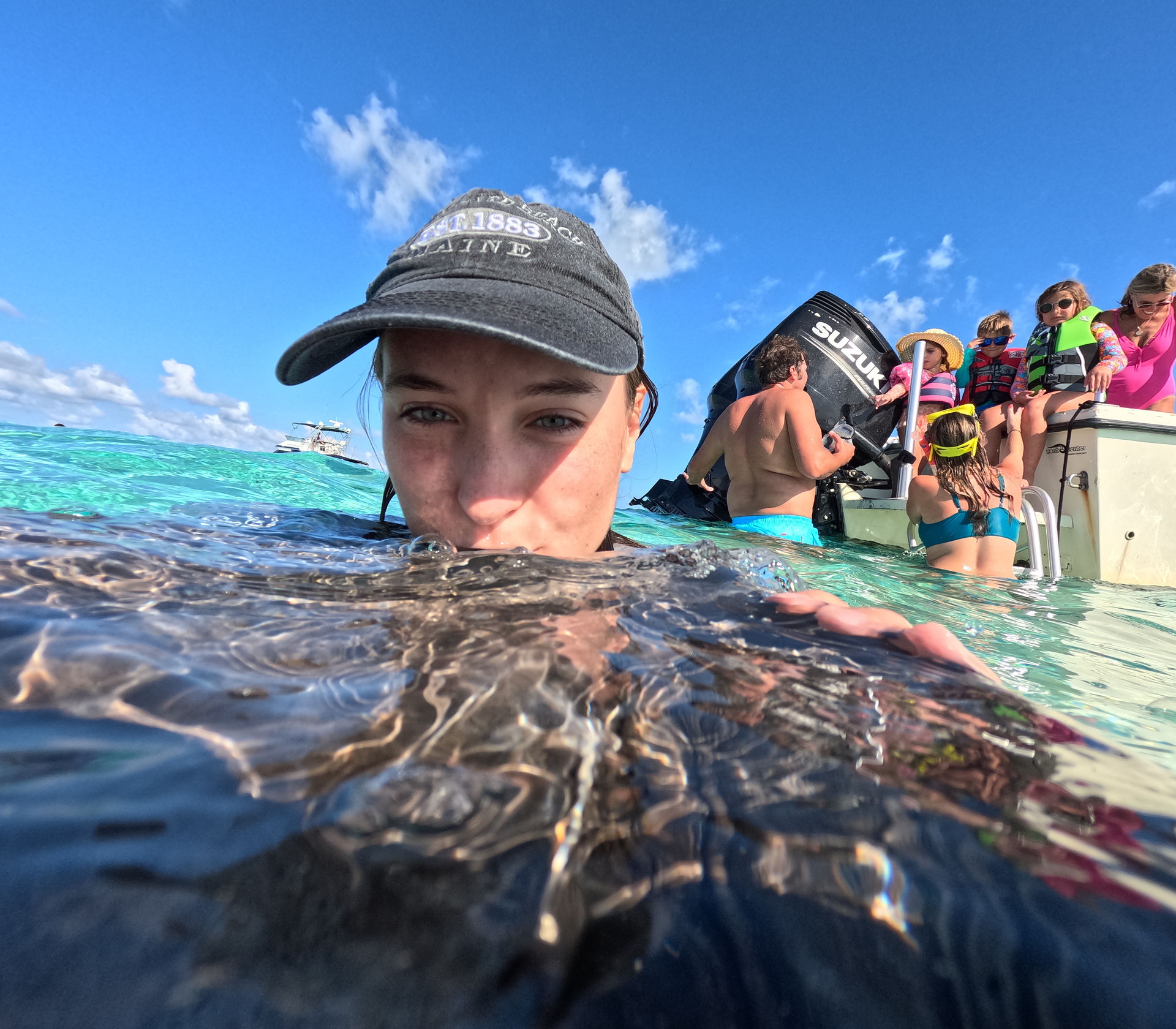 young girl kissing a stingray
