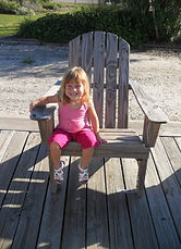 Small child in a large beach chair