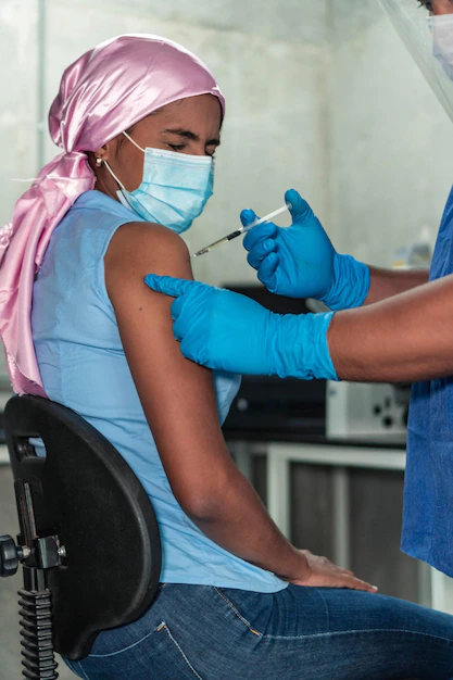 covid-19-vaccine-humans-woman-with-cancer-receiving-coronavirus-vaccine-injection-clinic_5