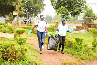 Volunteers picking up litter in a park