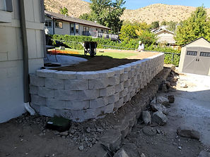 Retaining wall cement blocks in progress.jpeg
