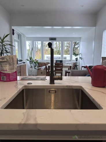 Kitchen plumbing renovation showing newly installed tap and basin in Auckland home.