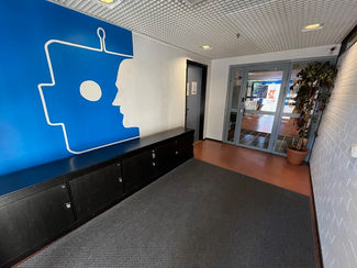 The company logo, painted at the entrance, warmly welcomes visitors while effectively showcasing the company's identity through vibrant colours.