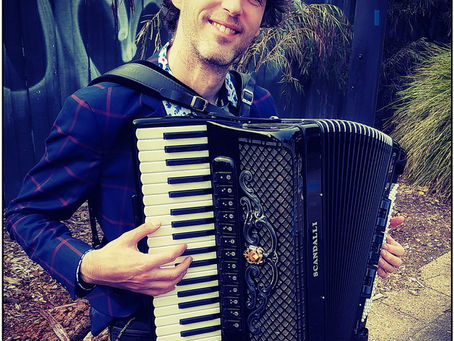A Busker With An Accordion