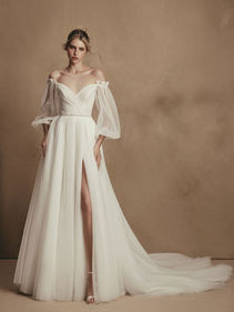 SALE DRESS - Millie is a bridal dress for a royal wedding. The bodice features a lowered shoulders neckline with illusion bell sleeves and an uncovered back looks fabulous. The skirt is made of many layers of veiling that look fantastic with a long train.

SALE - Available off the Peg £995, Was £1995
Perfect Condition other than a new zip is required