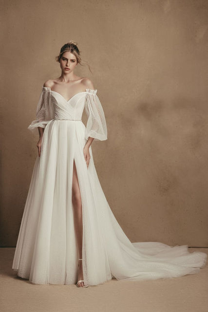 SALE DRESS - Millie is a bridal dress for a royal wedding. The bodice features a lowered shoulders neckline with illusion bell sleeves and an uncovered back looks fabulous. The skirt is made of many layers of veiling that look fantastic with a long train.
SALE - Available off the Peg £995, Was £1995
Perfect Condition other than a new zip is required