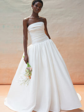 The Charlotte gown is as elegantly classic as she is flirtatious. Cut in our light and lustrous luxe taffeta fabric, the clean neckline leads way to a gathered bodice with a flattering drop waist.
The gathered ball skirt with side seam pockets was made to twirl the night away.