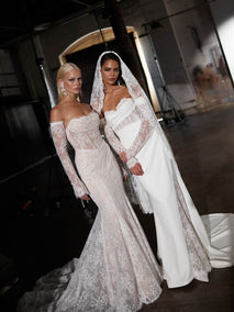 Delicate and divine is our Roxanne gown in Chantilly lace from top to toe. True high–fashion vintage inspired design in a modern interpretation, finished off in glamorous style with long detachable lace sleeves.
For the fashion forward bride who loves to add a little edge to stand out from the crowd, she features a strapless draped scoop neckline, illusion bodice with boned construction, and a modern V-shaped Basque waistline.
Her sexy fit and flare skirt accentuates the curves, flowing through to an exquisite eyelash hem detail. Long detachable lace sleeves continue across the strapless eyeline, adding drama and coverage right through to her fingers.
The illusion bodice corset continues through the back, with an eyelet laced finish which feeds into her dropped waist. In true mermaid style, the fuller lower skirt, generous train, and vertical button detail provides stunning drama from behind.
Shown in Chantilly sheet lace in ivory mocha, lined in our signature stretch jersey for comfort. For a simpler style, our Roxanne gown can also be ordered in plain crepe.