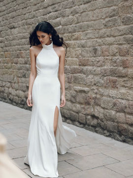 SALE DRESS The Justine gown features a chic mock neckline flattering fit and flare silhouette, and a stunning slit. She is a true modern classic. Was £1700 now £995