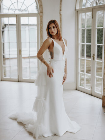 A Slim Fitted Wedding Dress in Crepe. Deep V Neckline
Style with the Odile Veil £300