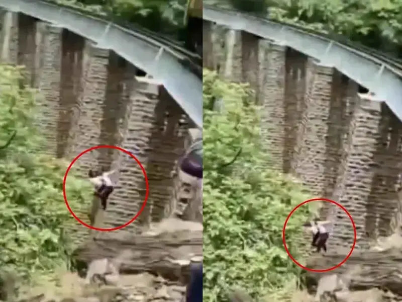 (VIDEO) Recién casados saltan de un puente para evitar ser arrollados por un tren durante una sesión de fotos