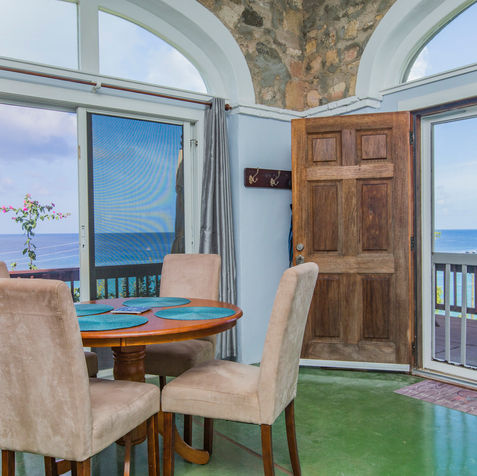 Ocean house dining table with ocean view. Book now Caribbean wedding and retreat. 