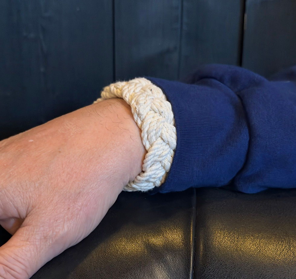 White braided Sailor Bracelet on a wrist