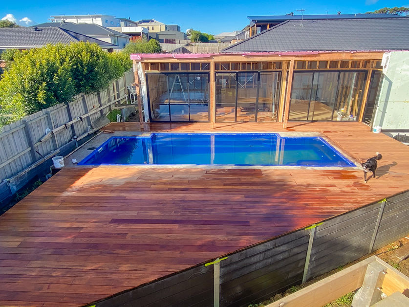 Elevated timber pool deck with pergola, designed and built by Jarrah Building Co.