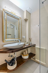Bathroom with walk-in rain shower and warm mosaic tiles in Monti, Rome — 1 minute from the Colosseum