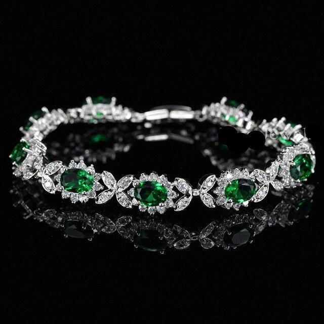 Diamond and emerald bracelet for a client in Mumbai, emerald buds with diamond petal motifs in each section.