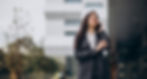 young-business-woman-classy-suit-by-office-center (1).jpg