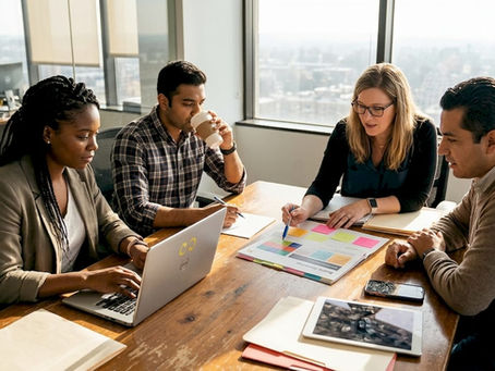 SME team reviews brand strategy materials