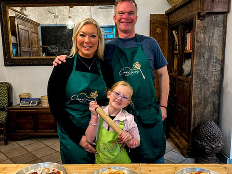 family of 3 at pizza cooking class in italy