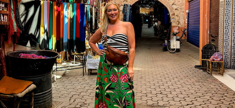 woman traveling with leather crossbody bag