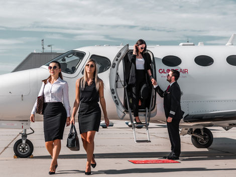 boarding private jet together on runway