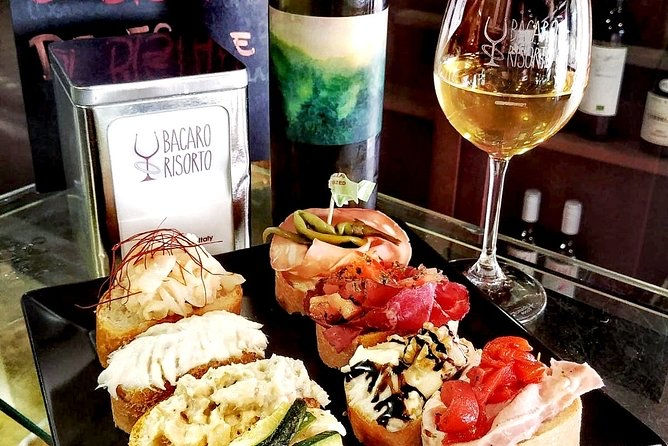 cicchetti and white wine at a bacaro in Venice, Italy