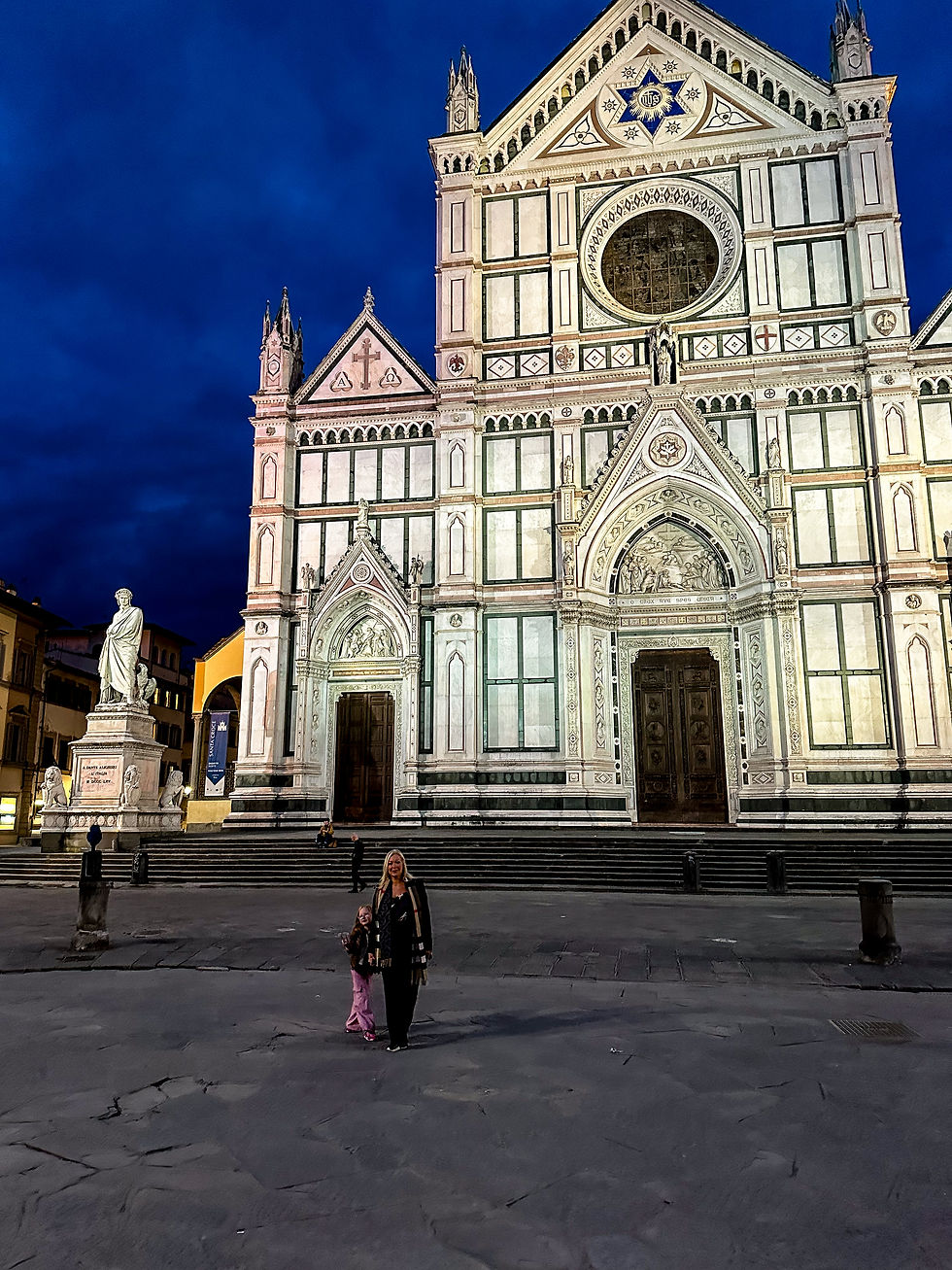 mother and daughter at santa croce in florence on a spring evening