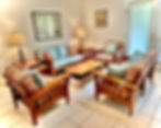 Wide angle view of a well-furnished living room filled with fine furniture