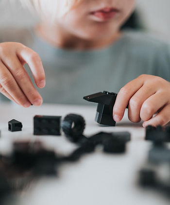 child playing with building blocks