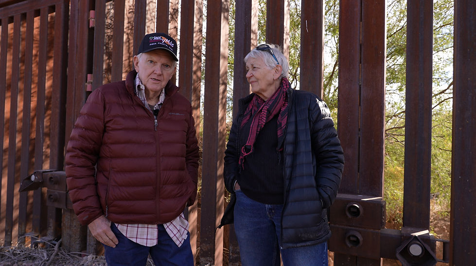 Jack Linda talking in front of border wall.jpg