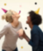 Women in Photobooth laughing and celebrating party