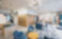 Acuity Eyecare's Wallan clinic reception area with patient seating and a wall display of sunglasses.