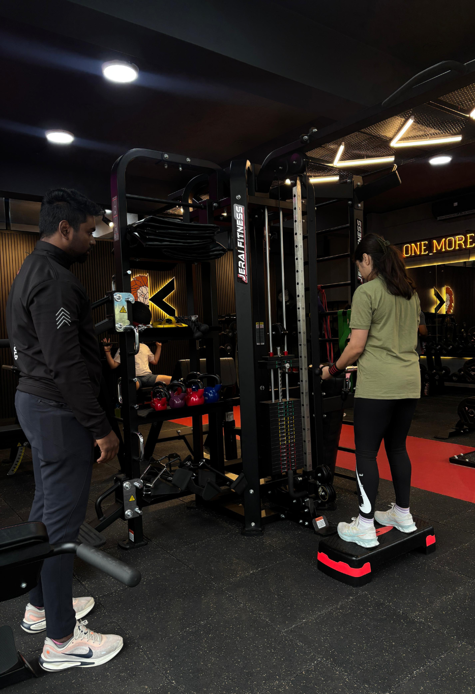 Close-up view of a fitness trainer guiding a client during a workout session