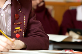 School kids wearing custom lapels designed by PW Australia, featuring personalised branding and school emblems for identification and recognition.