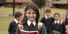 School girl with custom key ring from PW Australia, designed for independent schools featuring personalised branding and school logos.