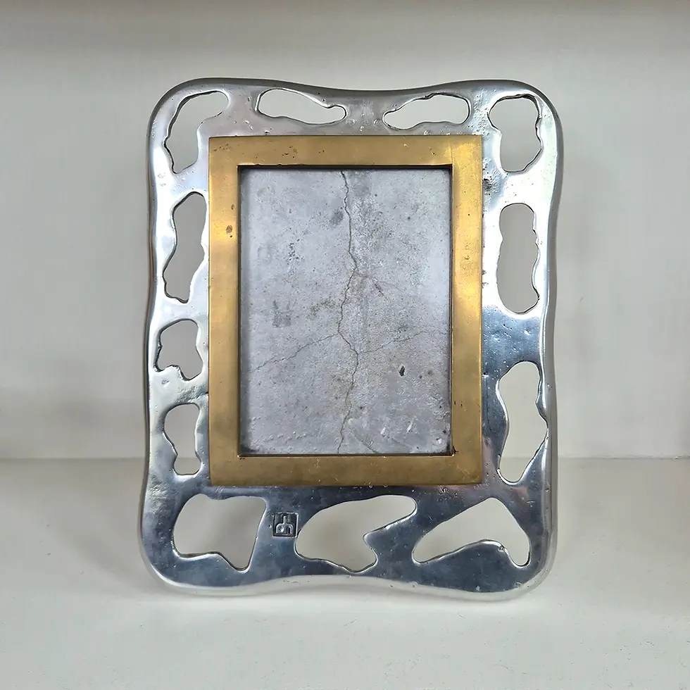 A rare Brutalist picture frame in solid Brass and Aluminium by David Marshal (front view)