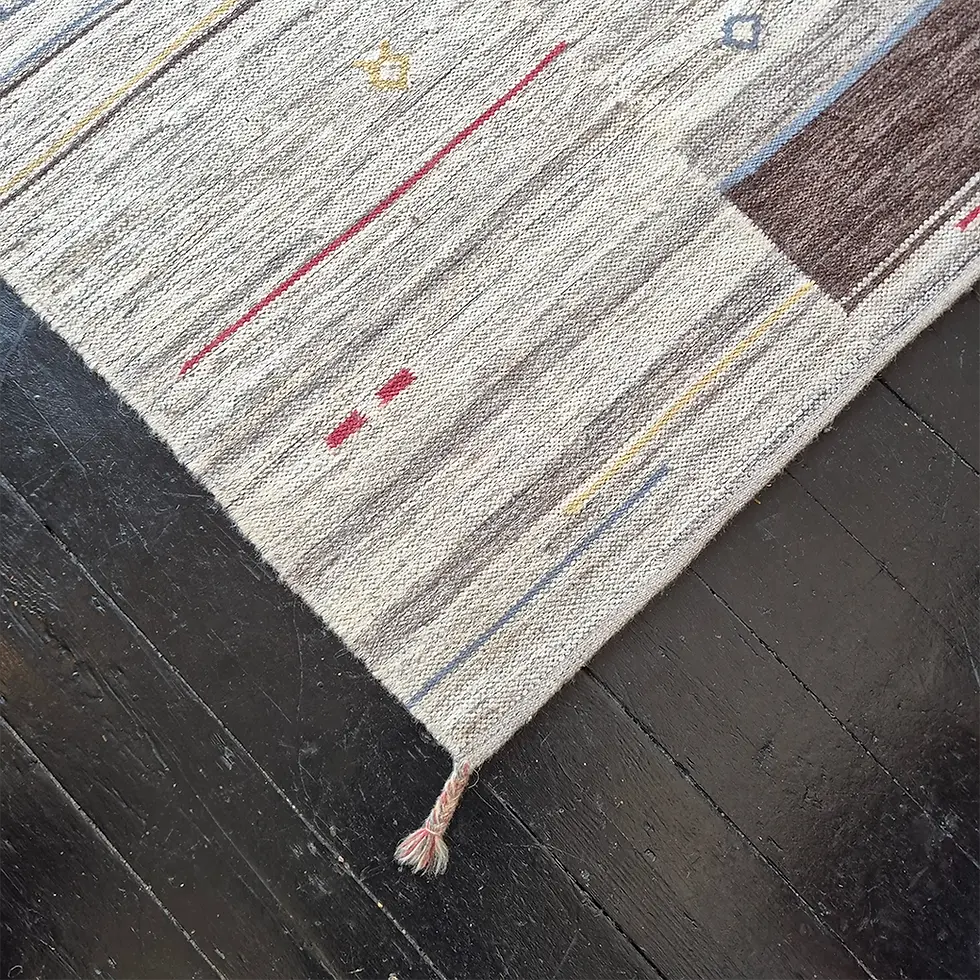 Thumbnail: A vintage Gabbeh style wooden floor rug in muted tones of Oatmeal and Grey - corner view